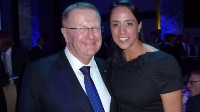 AOC president John Coates with former Olympic swimmer Nicole Livingstone in 2013.