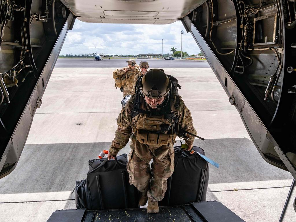 US Air Force Crisis Response Group officers board a Marine Corps MV-22 Osprey in Florida on their way to assist in the relief effort in the Bahamas. Picture: AFP