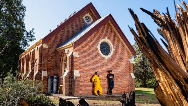 Father Mitchell Porter expected the church would’ve been lost to the savage fires, but was happily surprised when he returned to find it still standing. Picture: Simon Dallinger