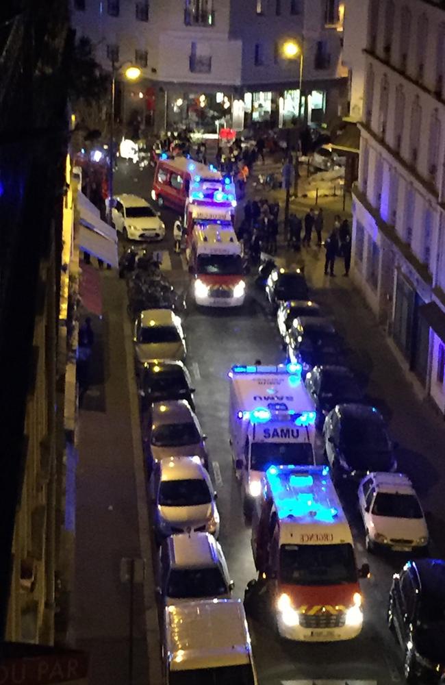 All on board ... Police officers and rescue workers at the Petit Cambodge restaurant.