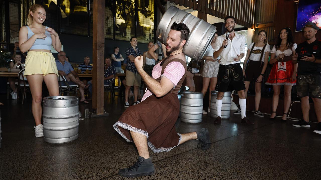 Matt Johnston gate crashes the keg lifting competition at Hemingway's Brewery's Oktoberfest celebrations. Picture: Brendan Radke