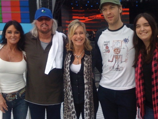 Chris Martin with Olivia Newton-John and Barry Gibb at the Sound Relief concert in 2009. Picture: Michael Jackson