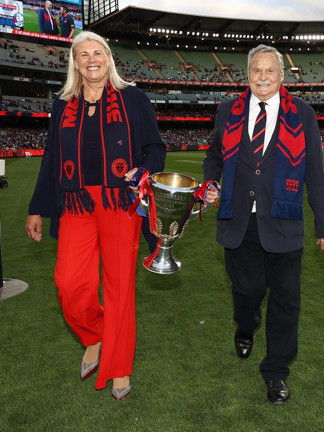 Kate Roffey and Barassi carry the Premiership cup off the MCG in 2022. Picture: Michael Klein