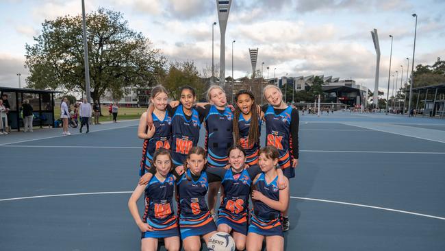 Armstrong Creek Pink Sharks under-11 netball team pull their funniest faces.
