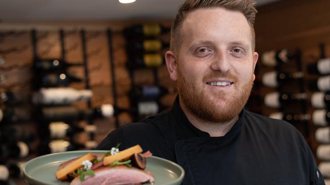 Joshua Mason with the duck which is aged for eight days. Picture: Monique Harmer