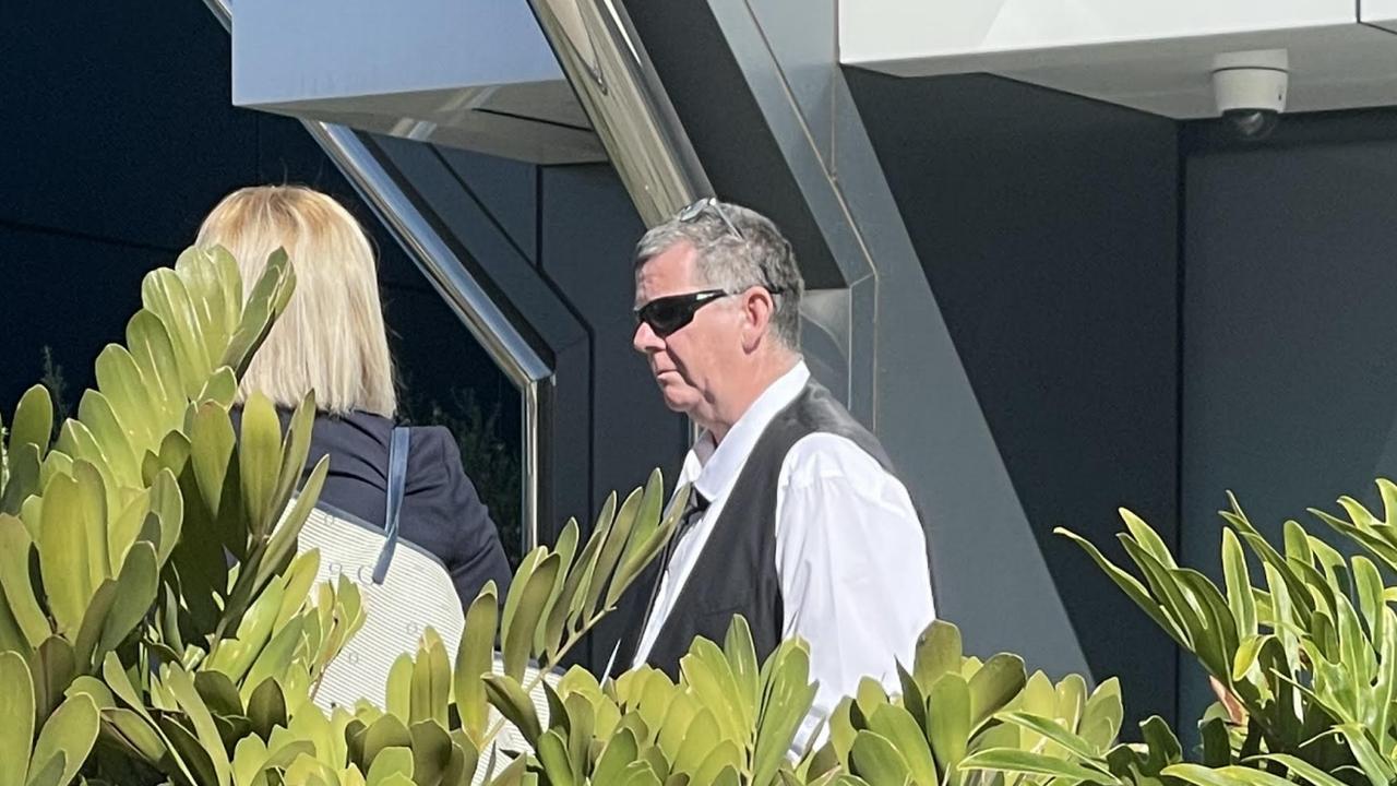 Ashley Allen Dynon speaks with his lawyer outside Toowoomba Courthouse on Monday, August 21, 2023.