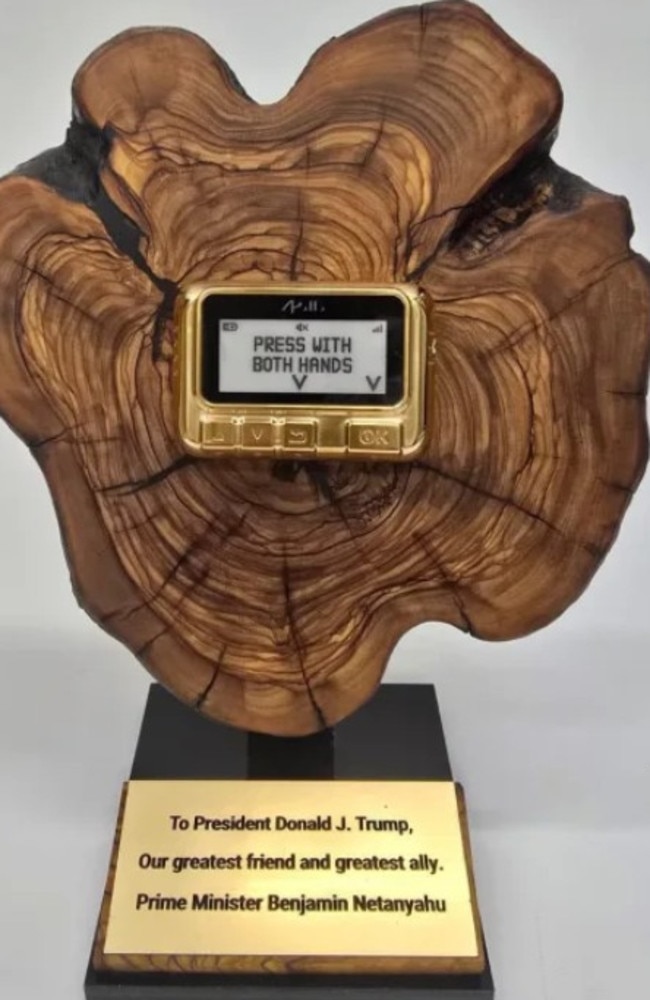 Israeli Prime Minister Benjamin Netanyahu has gifted US President Donald trump a golden pager as a memento of the ones used to blow up Hezbollah operatives in Lebanon. Picture: Israeli Government Press Office