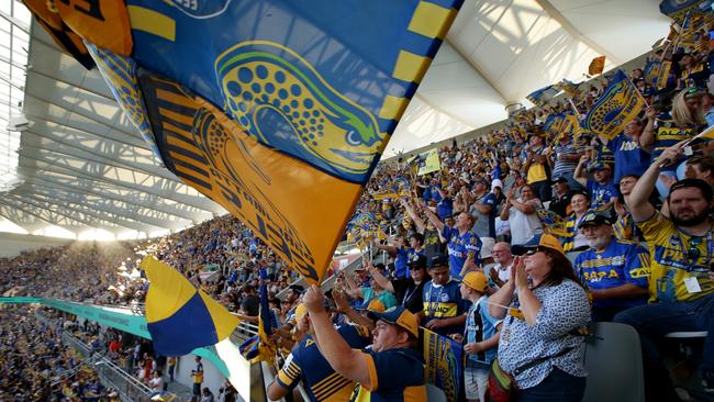 Eels fans celebrating at the first NRL match between Parramatta and Wests Tigers at the new Bankwest Stadium. Picture: Jonathan Ng