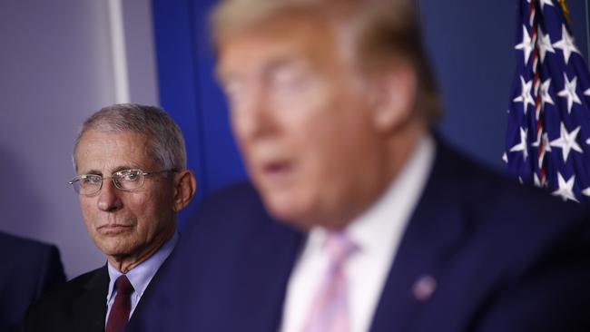 Director of the National Institute of Allergy and Infectious Diseases Dr Anthony Fauci listens as President Donald Trump speaks during a coronavirus task force briefing at the White House. Picture: AP