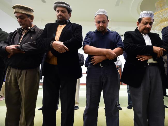 Bridging divides ... Muslims at the Baitul Hameed Mosque in Chino, California in a prayer vigil to commemorate lives lost a day after the tragedy in San Bernardino. Picture: Frederic Brown.