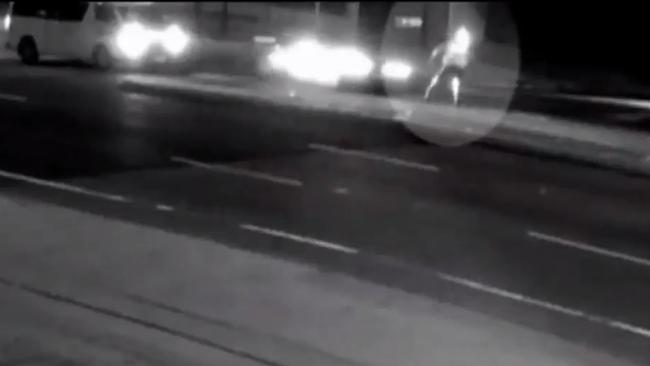 CCTV shows the officer attempting to flag down a vehicle before the incident. Picture: Channel Seven