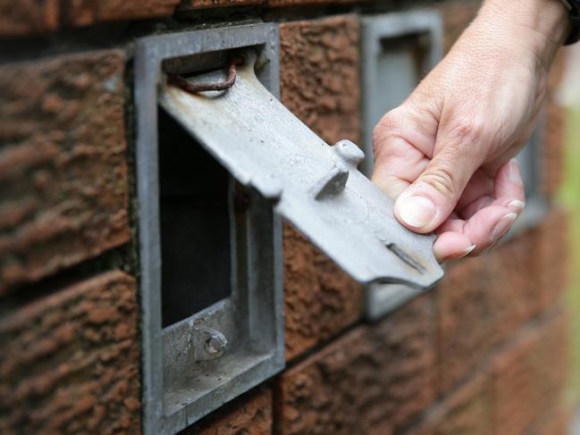 Police showing how easy it is for letterbox thefts, most commonly unlocked or to small for letters.