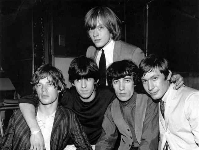 Rolling Stones co-founder Brian Jones, back, died under strange circumstances.