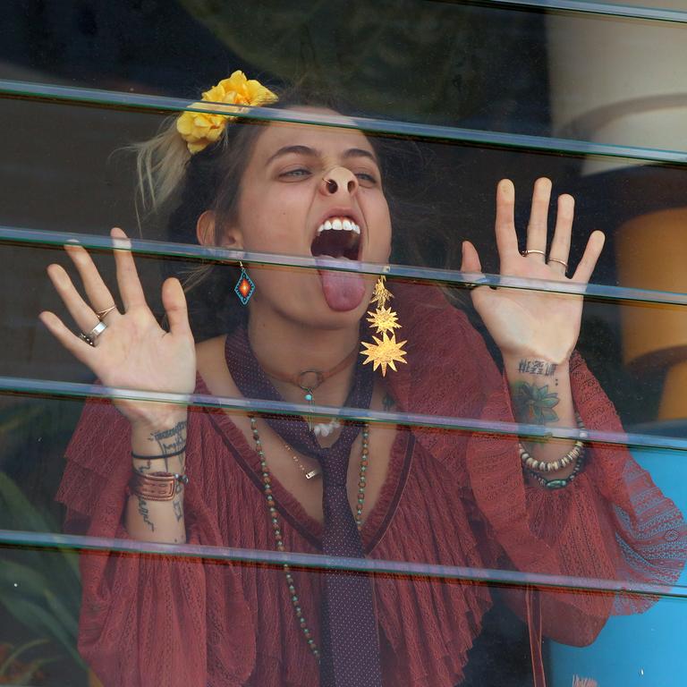 Paris Jackson played up to photographers by sticking her nose against the glass of the Myer Marquee at the 2017 Melbourne Cup. Picture: Stuart McEvoy/The Australian