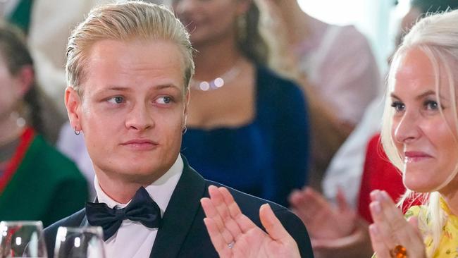 Marius Borg HÃ¸ sitting next to his mother Norwegian Crown Princess Mette-Marit. Picture: Lise Ã&#133;serud / NTB / AFP) / Norway OUT