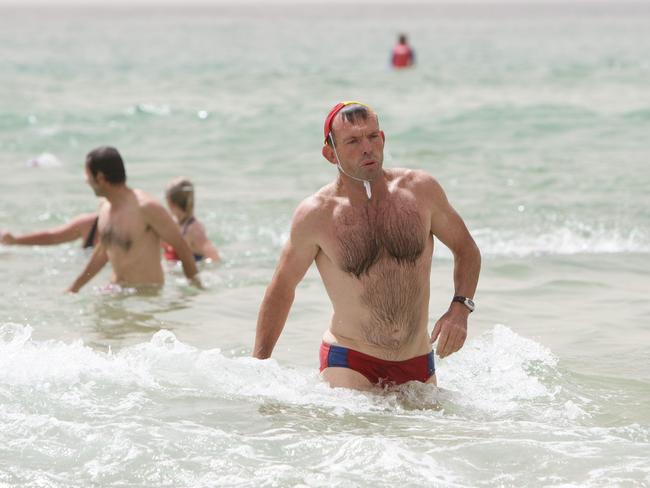 Tony Abbott pictured in his Budgy Smugglers while taking part in a surf patrol at the Queenscliff Surf Club. Picture: News Local.