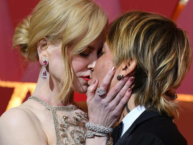 She broke out in a rash (seen here, while making out with Keith Urban). Picture: AFP