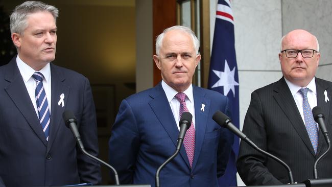 Minister for Finance Senator Mathias Cormann, left, PM Malcolm Turnbull and Attorney General Senator George Brandis. Picture: Kym Smith.