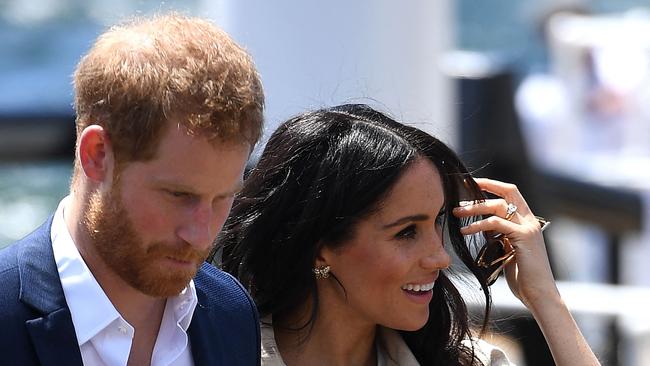 Prince Harry and wife Meghan arrive for a public walk at the Sydney Opera House in Sydney. Picture: Pool/AFP