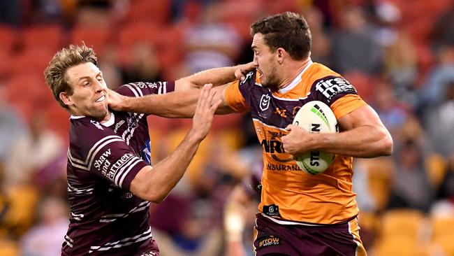 Corey Oates breaks away from the Sea Eagles defence. Picture: Bradley Kanaris/Getty Images