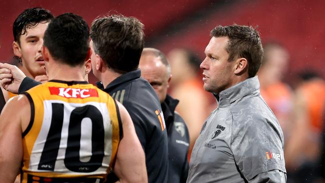 Hawks coach Sam Mitchell (far right) wants a greater spread of midfield contributors. Picture: Getty Images