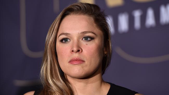 Ronda Rousey speaks to journalists during a media call at Etihad Stadium in Melbourne,  Friday, Nov. 13, 2015. Rousey and Holly Holm will fight for the women's UFC bantam weight title on Sunday. (AAP Image/Julian Smith) NO ARCHIVING