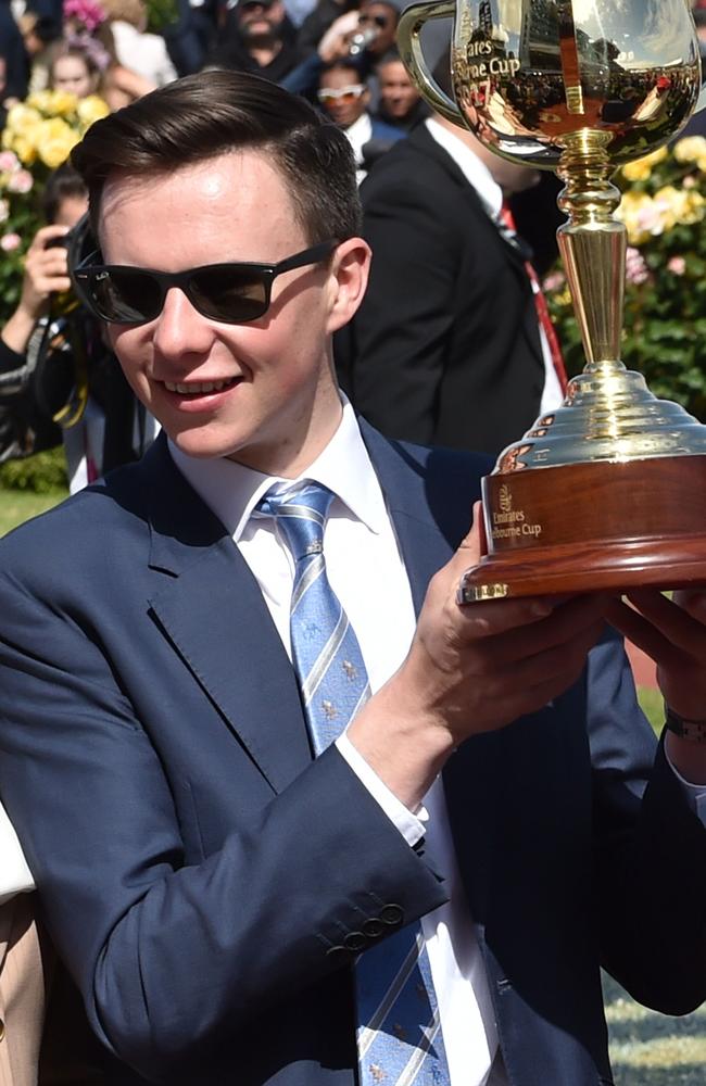 Trainer Joseph O'Brien lifts the trophy after his horse Rekindling won the 157th Melbourne Cup. Picture: AAP