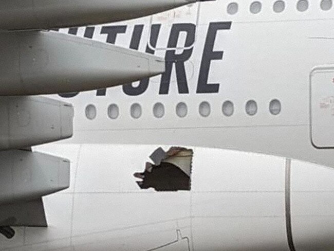 Passengers and crew disembarked to find a large hole in the side of the plane. Picture: Supplied