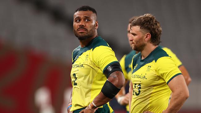 Samu Kerevi and Lewis Holland of Team Australia after their tough loss during the Rugby Sevens Men's Quarter-final match between Australia and Fiji. (Photo by Dan Mullan/Getty Images)