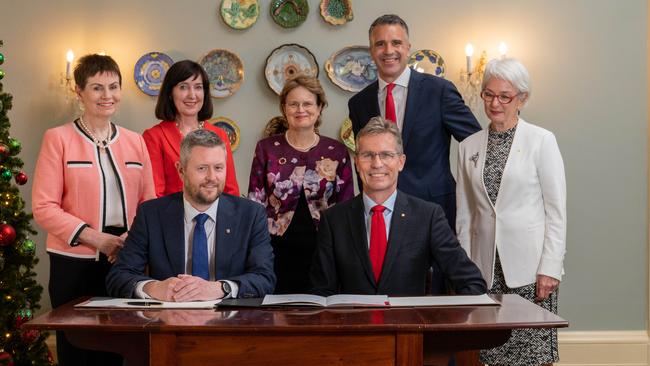 UniSA chancellor Pauline Carr, Deputy Premier Susan Close, Governor Frances Adamson, Premier Peter Malinauskas, University of Adelaide chancellor Catherine Branson (l-r front) UniSA vice-chancellor David Lloyd and University of Adelaide vice-chancellor Peter Hoj. Picture: Naomi Jellicoe