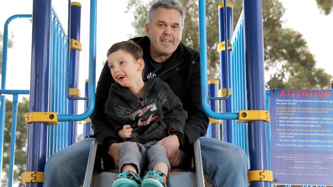 Disability advocate Ben Waechter with his son Harry, 7, who has cerebral palsy, has welcomed a Salisbury Council committee plan to build five new playgrounds. Picture: Dean Martin