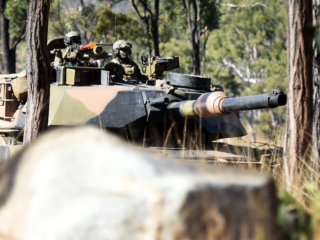 M1 Abrams Tank patrols the outskirts of the urban landscape. Varies personal from 1, 2 and 3 RAR competed in Subject 2 Corporal infantry Section Commander Course at High Range, Townsville. Picture: Alix Sweeney