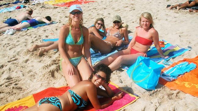 Bali Bombing survivor Penny Morse (front kneeling) at the beach with Lisa Sandher (back middle) before their childhood friends Francoise Dahan (front) Renae Anderson and Simone Hanley were killed when a car bomb went off outside the Sari Club.