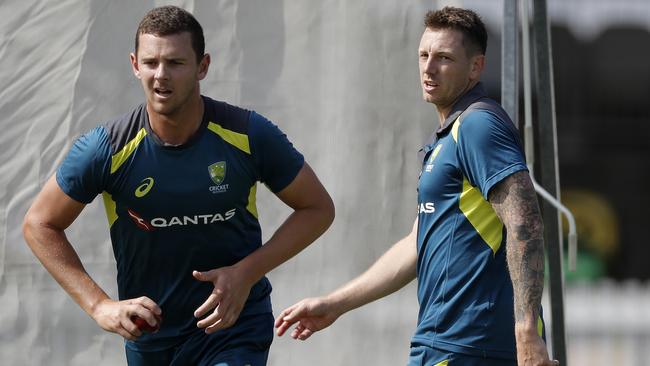 Josh Hazlewood bowls as James Pattinson looks at a nets session at Lord’s on Monday. Picture: Getty Images