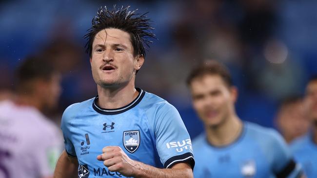 SYDNEY, AUSTRALIA - JANUARY 08: Joe Lolley of Sydney FC celebrates scoring a penalty goal during the round 11 A-League Men match between Sydney FC and Perth Glory at Allianz Stadium, on January 08, 2025, in Sydney, Australia. (Photo by Jason McCawley/Getty Images)