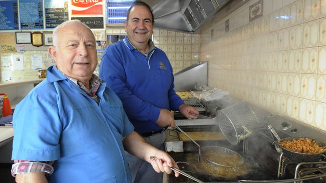 Bill Petinarias and Tom Podardu have been working together at the Seaford fish and chip shop for 40 years. (Photo: Leader Newspapers 2009)