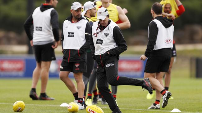 Bombers head coach John Worsfold, middle, during an Essendon Football Club training session this week. Picture: AAP Image/Daniel Pockett