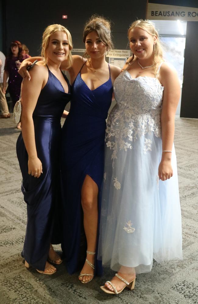 Amelia Kubler, Bella Panayi and Gabby Owen celebrate their 2023 St John's College formal.