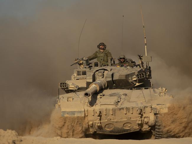 ISRAEL - JULY 08: An Israeli soldiers sit on a tank as he is moving a long the border with the Gaza Strip on July 8, 2024 in Southern Israel. More than nine months have passed since the Oct. 7 attacks by Hamas, which spurred Israel's invasion of Gaza. Fighting there continued over the weekend, although there have been reports of progress with negotiations around a potential cease-fire deal. (Photo by Amir Levy/Getty Images) *** BESTPIX ***