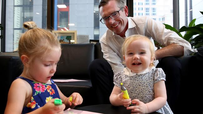 Dominic Perrottet with daughters Harriet, 3, and Beatrice, 1, in his city office. Picture: Toby Zerna