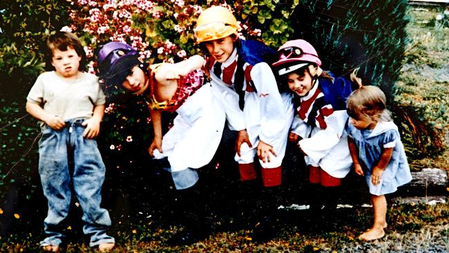 Payne children horsing around: Steven, Andrew, Patrick, Catherine and Michelle.