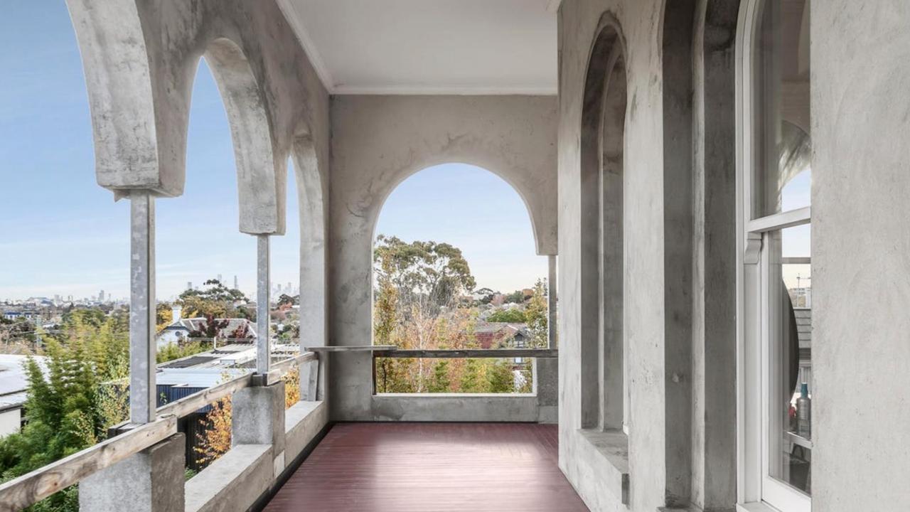 From the upstairs veranda, the home offers rare panoramic views stretching from South Yarra to the Melbourne CBD skyline.