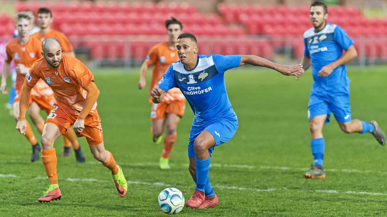 AT THE DOUBLE: South West Queensland Thunder striker Travis Cooper (right) scored twice in his side&#39;s 5-0 defeat of Cairns on Saturday at Toowoomba&#39;s Clive Berghofer Stadium. Picture: Kevin Farmer