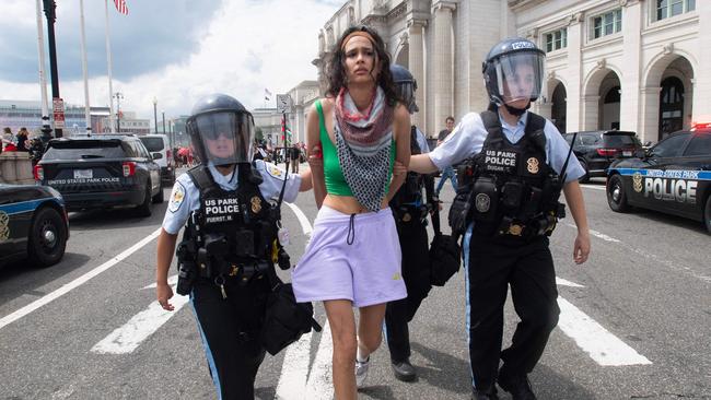 One protester being arrested. Picture: Matthew Hatcher/AFP