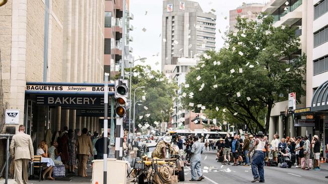 Papers erupt during an on-set explosion on Pirie St. Picture: Morgan Sette/ The Advertiser