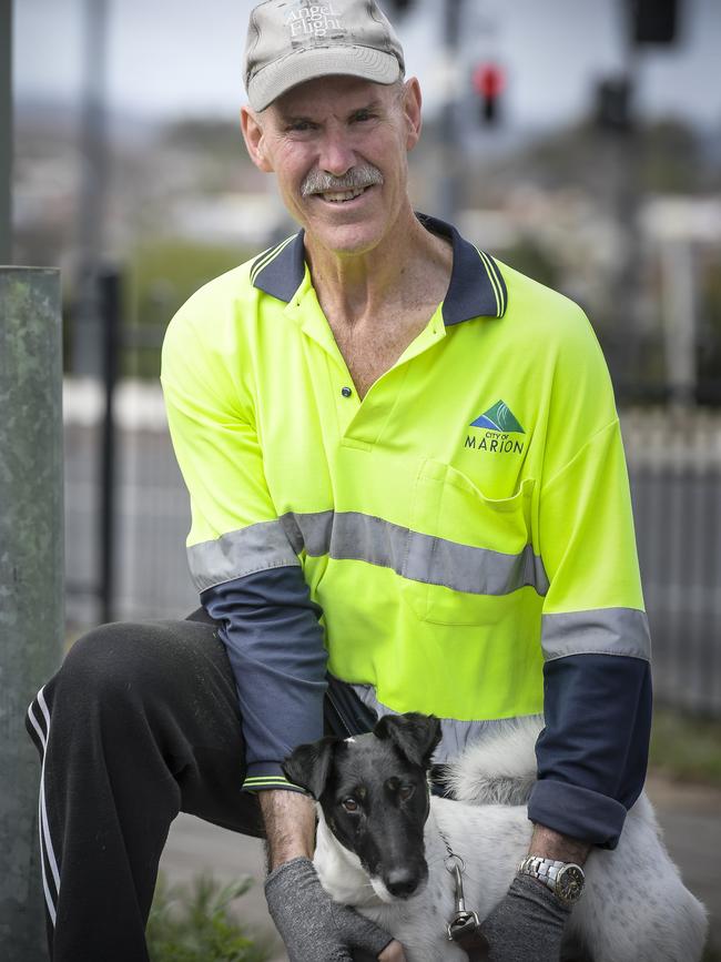 Alex spends his retirement years cleaning graffiti in the Marion City Council area, pictured here on a morning route with his fox terrier, Baxter. Picture: Roy VanDerVegt