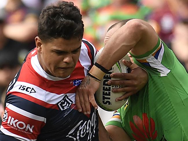 BRISBANE, AUSTRALIA - MAY 12: Latrell Mitchell of the Roosters is tackled during the round nine NRL match between the Sydney Roosters and the Canberra Raiders at Suncorp Stadium on May 12, 2019 in Brisbane, Australia. (Photo by Albert Perez/Getty Images)