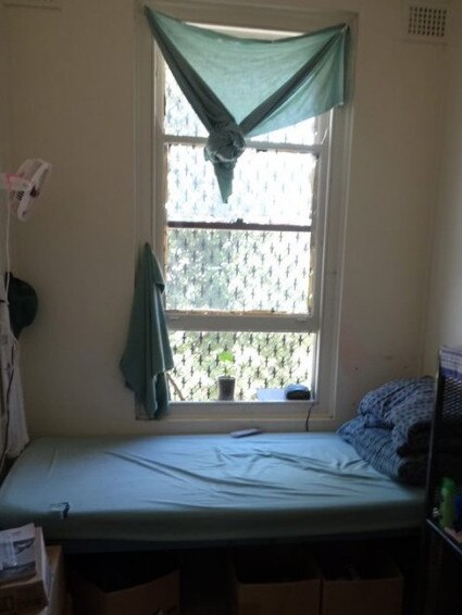 A photo of a sheet being used as a curtain in an inmate’s cell.