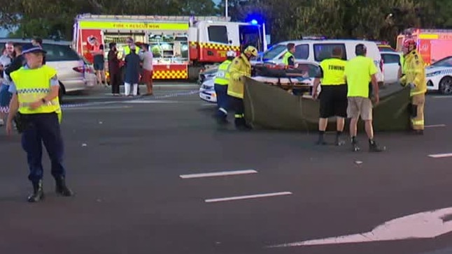 Police secure the area on busy Windsor Rd at Baulkham Hills. Picture: Jason Webster/TNV