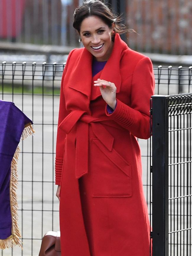 The  Duchess of Sussex waves to members of the public before unveiling a plaque. Picture: AFP 